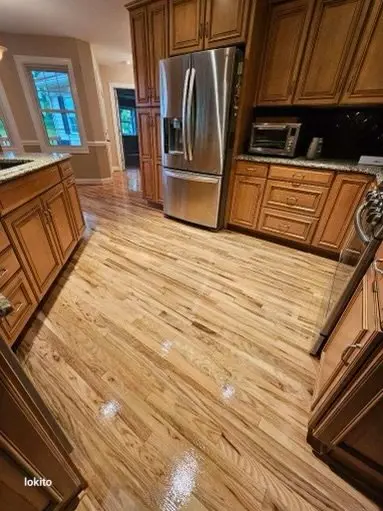 Hardwood floor refinishing in kitchen